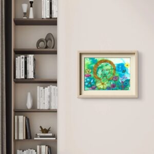 A framed painting on a warm beige wall next to a styled bookcase, depicting a serene face surrounded by a golden circle and colourful flowers in turquoise, pink and yellow, set in a light wooden frame.