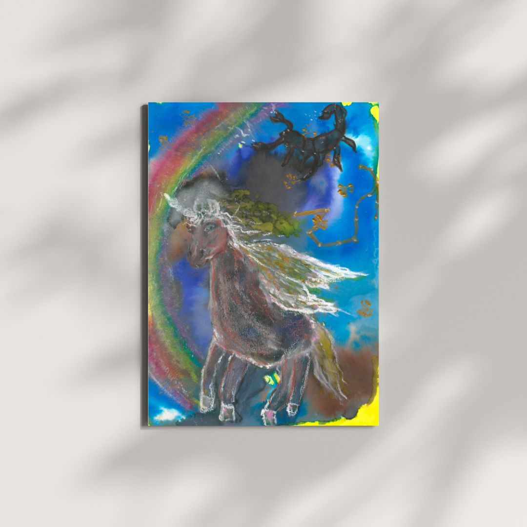 A brown unicorn with a white horn stands on an A4 artwork featuring the Scorpio constellation in gold. A scorpion is drawn in the top right corner. The background is blue, with a rainbow behind the unicorn on the left. The artwork is created with ecoline, oil pastels, and gold acrylic.