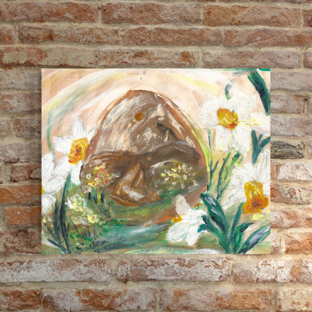 A textured painting mounted on a rustic brick wall, featuring a curled-up figure inside a cave-like structure, surrounded by blooming white and yellow flowers. The artwork has earthy tones, green hues, and a soft rainbow arch in the background.
